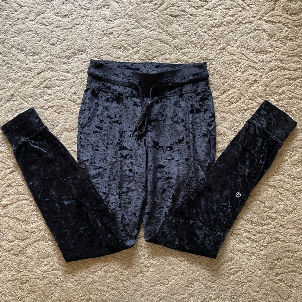 Black Lululemon crushed velvet joggers with pockets and drawstring